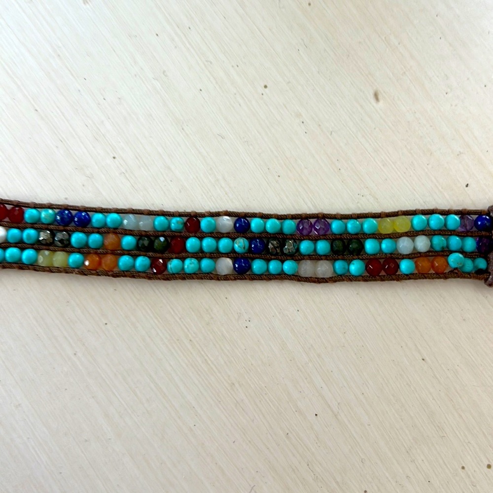 Multicolored gemstone leather wrap bracelet.